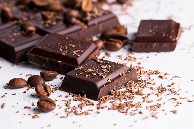 Dark chocolate bar and coffee beans
